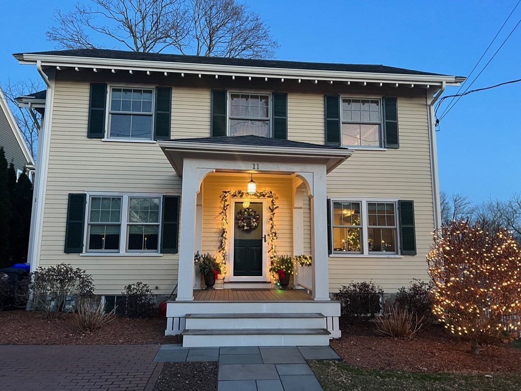11 Fletcher Road, Unit 11 Bedford, MA 01730 - Photo 28 of 31 a view of a house with a large windows and plants
