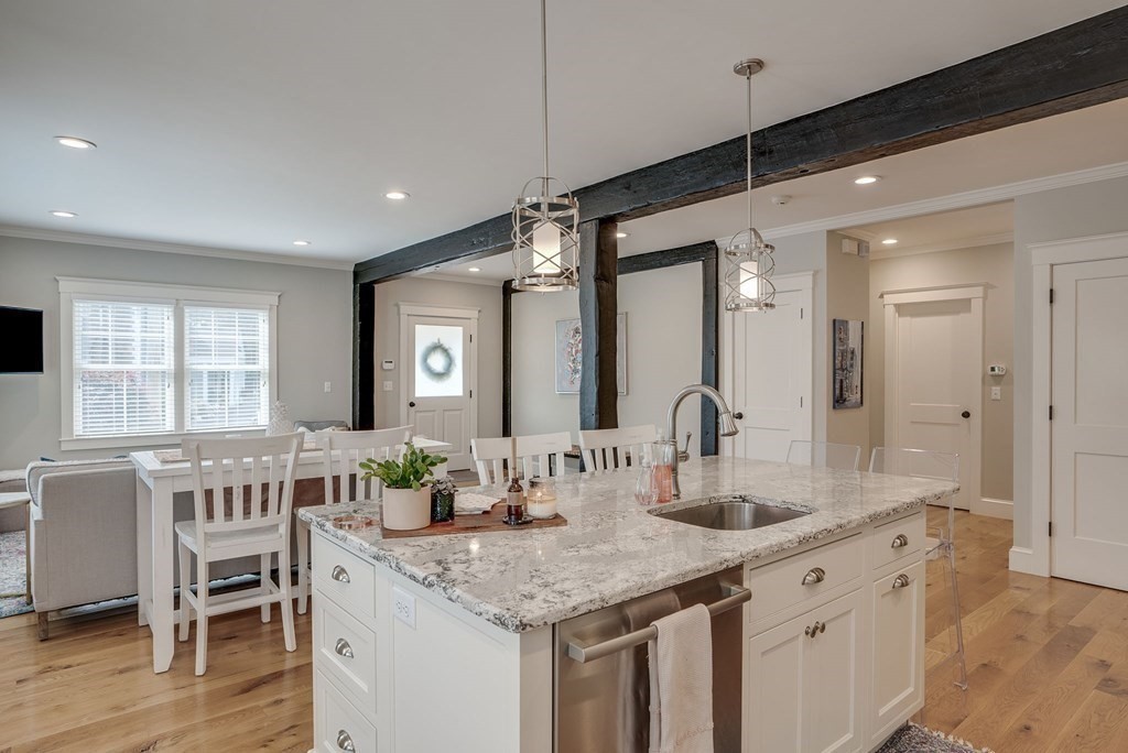11 Fletcher Road, Unit 11 Bedford, MA 01730 - Photo 6 of 31 a bathroom with a granite countertop sink and a mirror