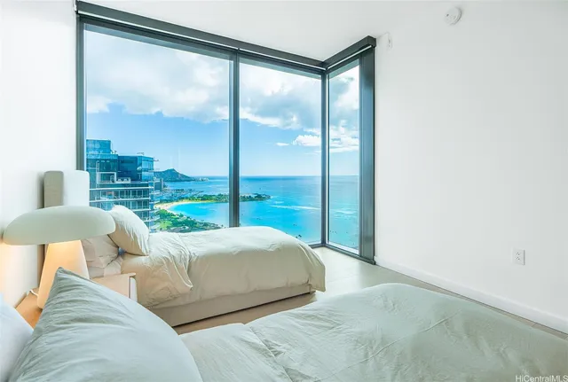 a bed sitting in a bedroom next to a window
