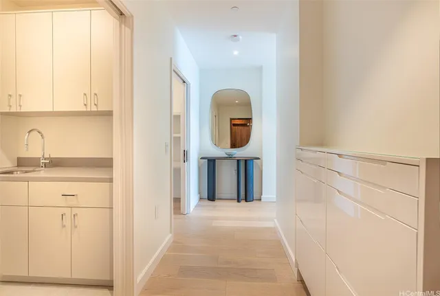 a front view of a house with wooden floor and windows