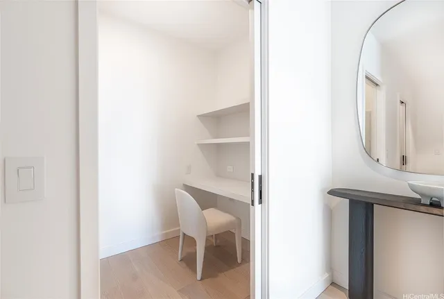 a view of a hallway with workspace