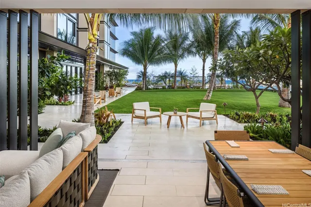 a view of a house with pool and sitting area