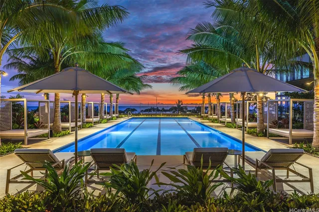 a swimming pool with outdoor seating yard and outdoor seating