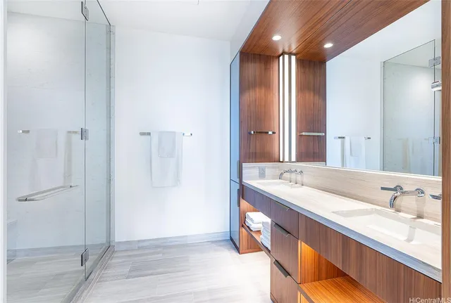 a bathroom with a double vanity sink and a mirror