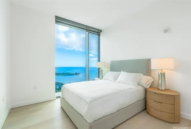 a bedroom with a bed and a lamp