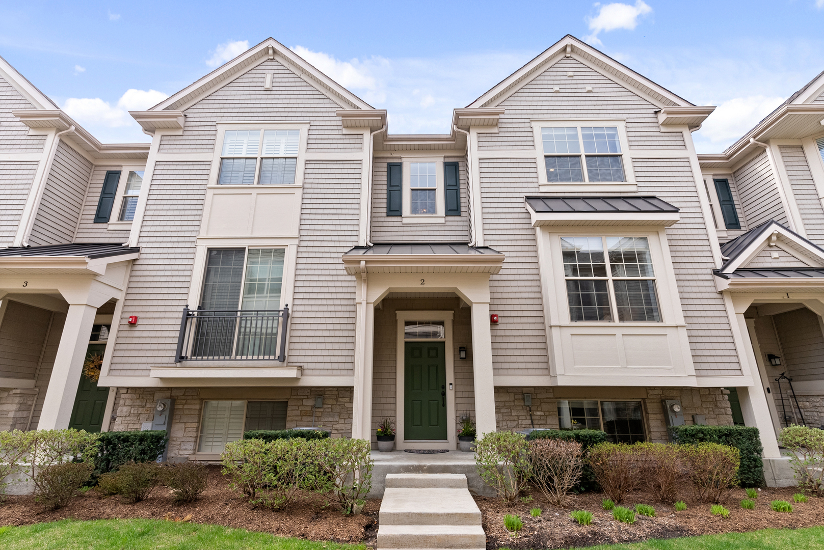 303 South NW Highway, Unit 2 Park Ridge, IL 60068 - Photo 1 of 30 a front view of a house with a yard