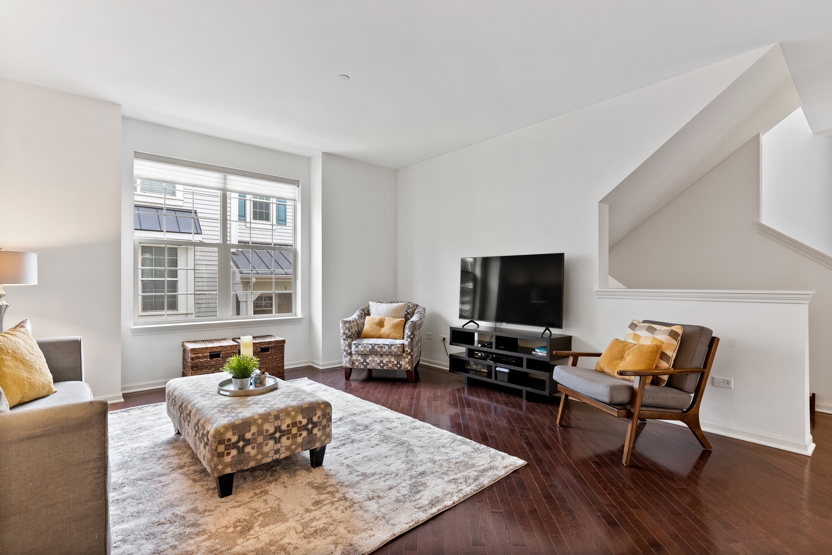 303 South NW Highway, Unit 2 Park Ridge, IL 60068 - Photo 5 of 30 a living room with furniture and a flat screen tv with wooden floor