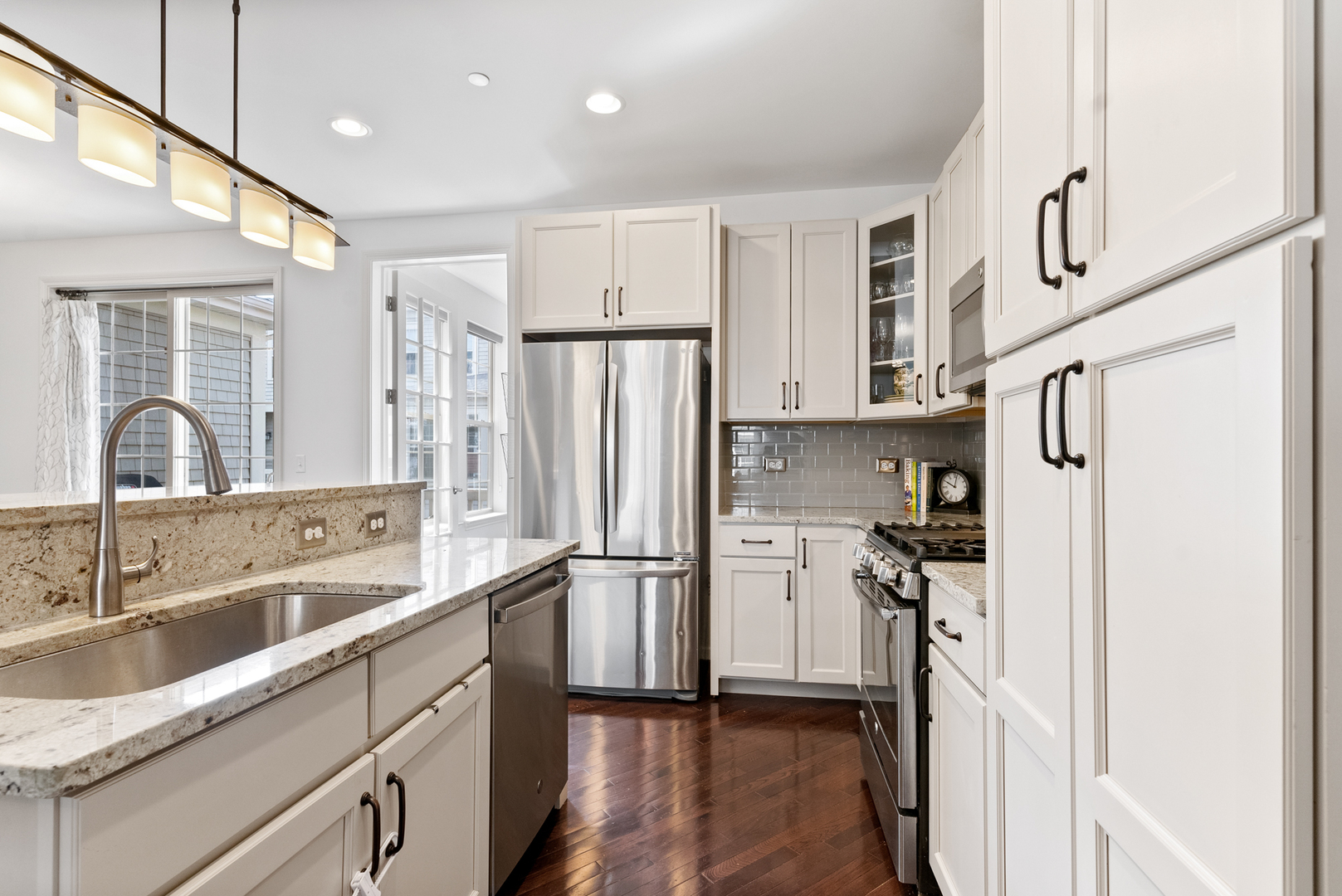 303 South NW Highway, Unit 2 Park Ridge, IL 60068 - Photo 9 of 30 a kitchen with stainless steel appliances sink refrigerator and cabinets