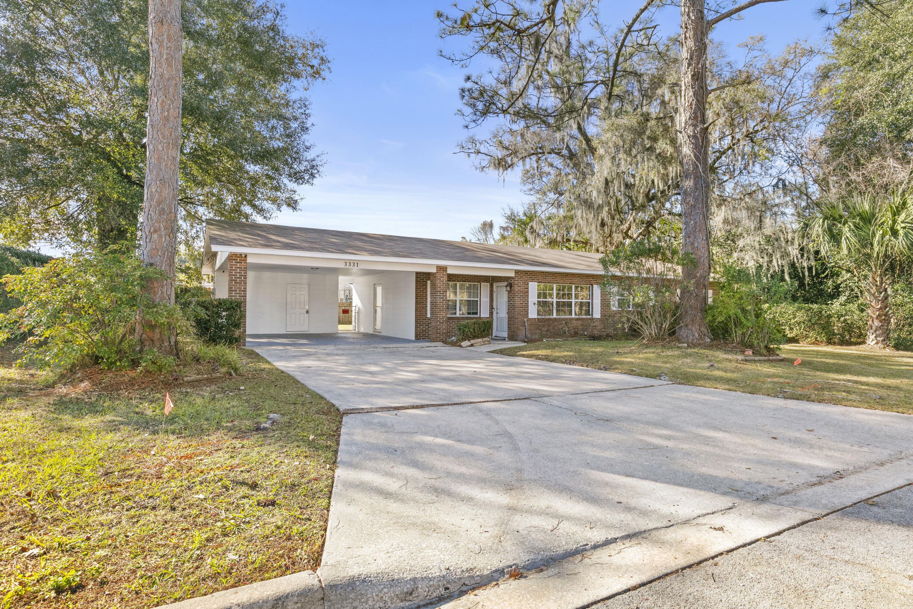 3331 Northwest 27th Avenue Gainesville, FL 32605 - Photo 2 of 29 front view of a house with a garden