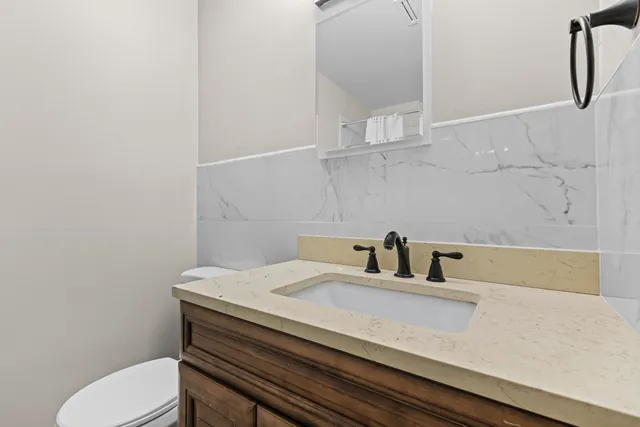 a bathroom with a sink and toilet