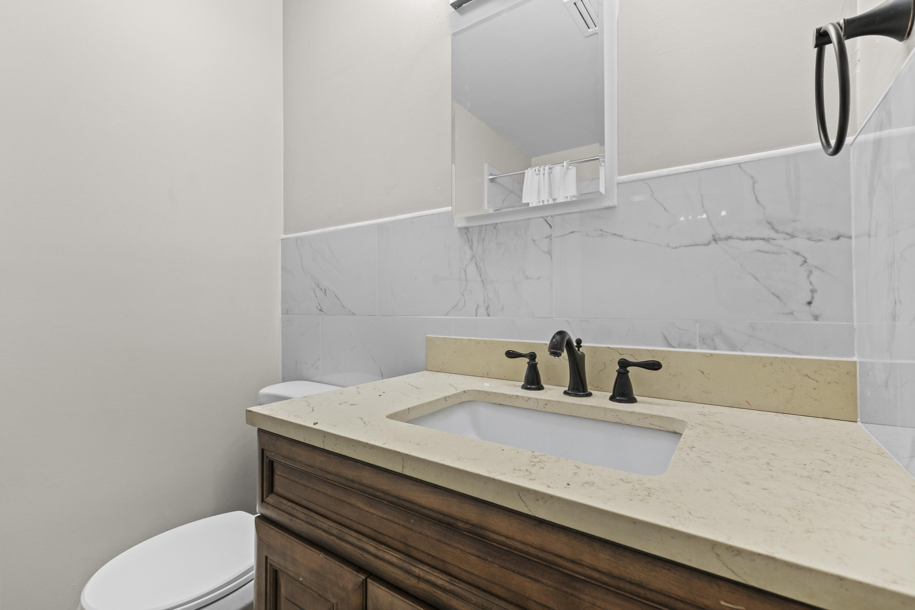 3331 Northwest 27th Avenue Gainesville, FL 32605 - Photo 22 of 29 a bathroom with a sink and toilet