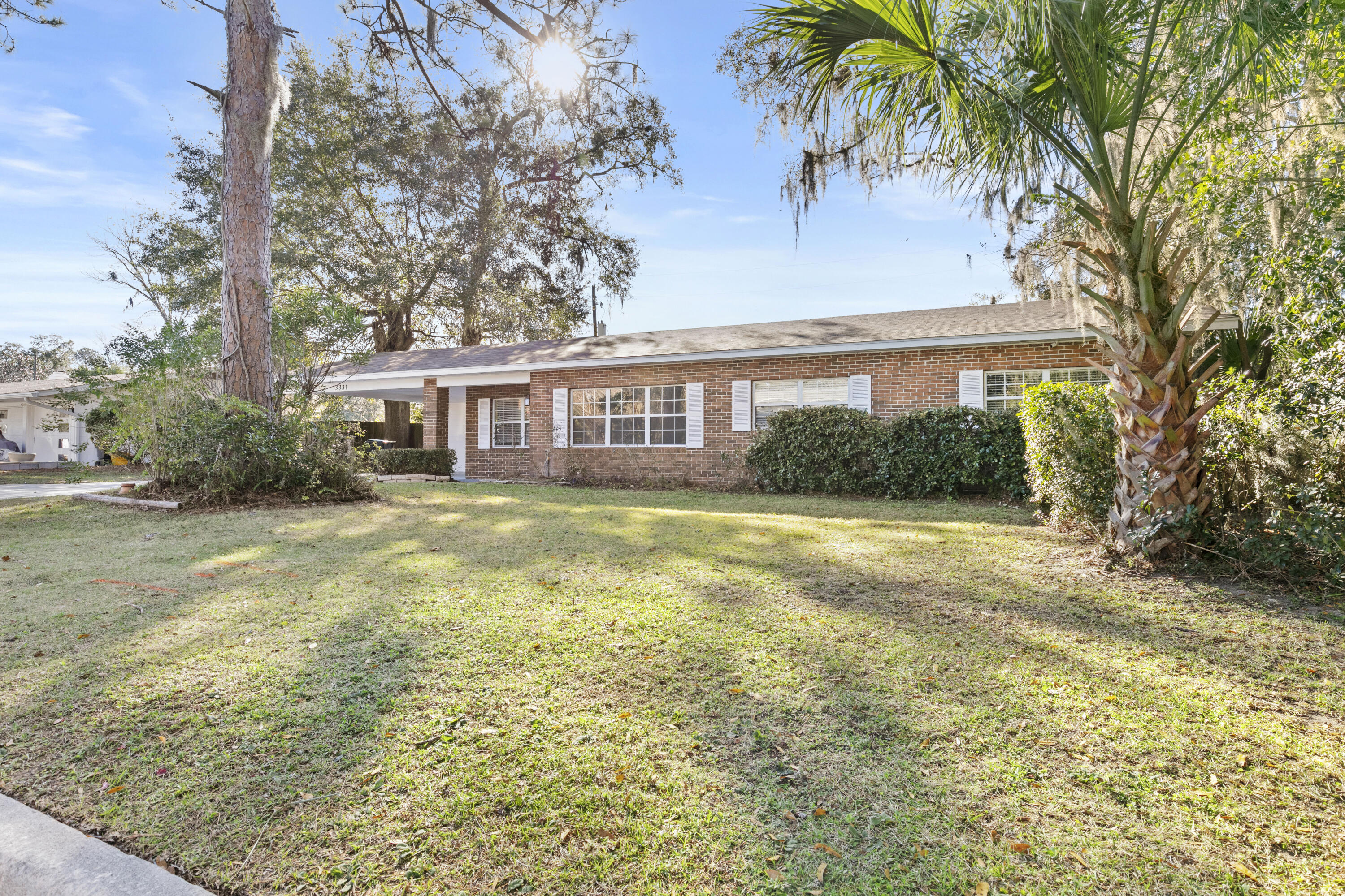 3331 Northwest 27th Avenue Gainesville, FL 32605 - Photo 4 of 29 a view of house with swimming pool and a yard