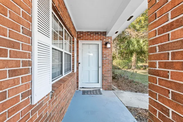 a view of a brick house with a door