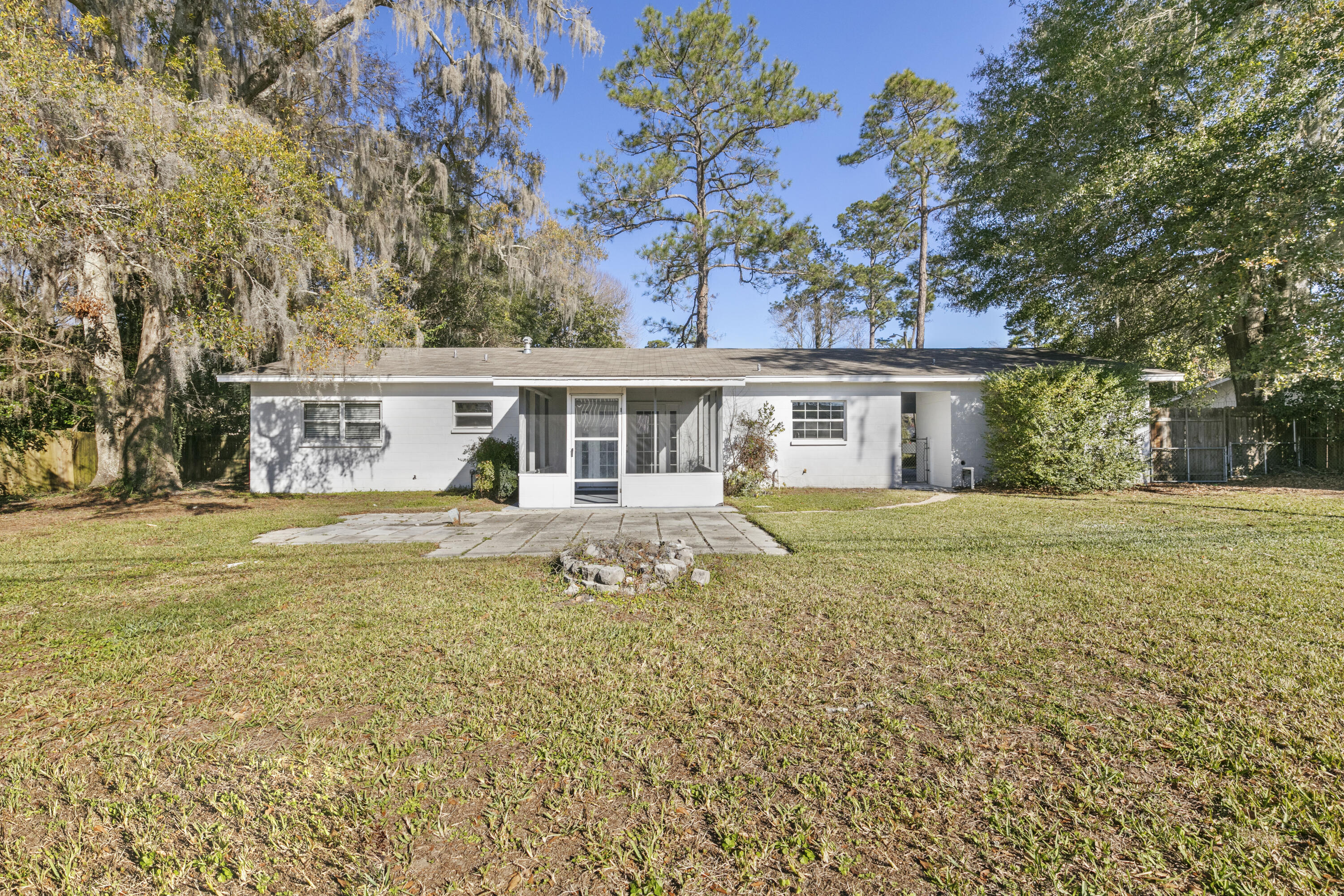 3331 Northwest 27th Avenue Gainesville, FL 32605 - Photo 8 of 29 a front view of a house with a garden