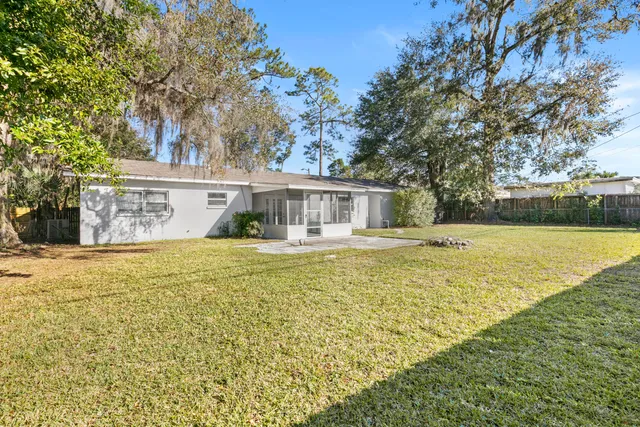 a front view of a house with swimming pool and glass top