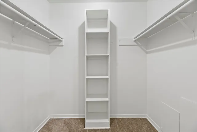 a bathroom with a toilet a sink and a mirror