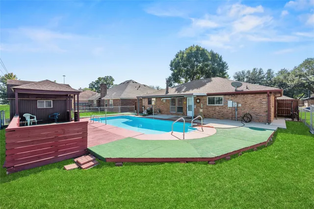 a view of a house with a yard porch and sitting area