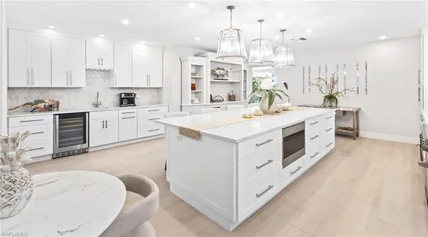 a spacious bedroom with a bed and a large window