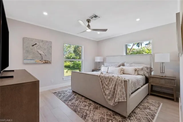 a bed room with a bed and a window