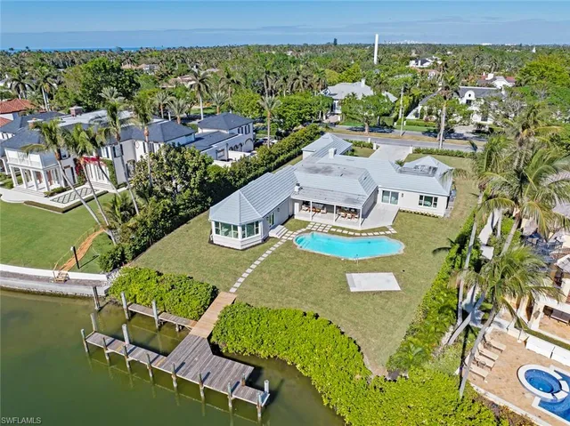 an aerial view of a house with a swimming pool