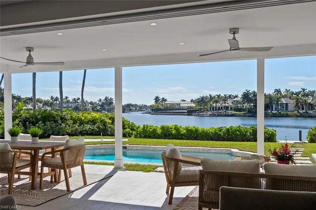 a view of a patio with couches table and chairs