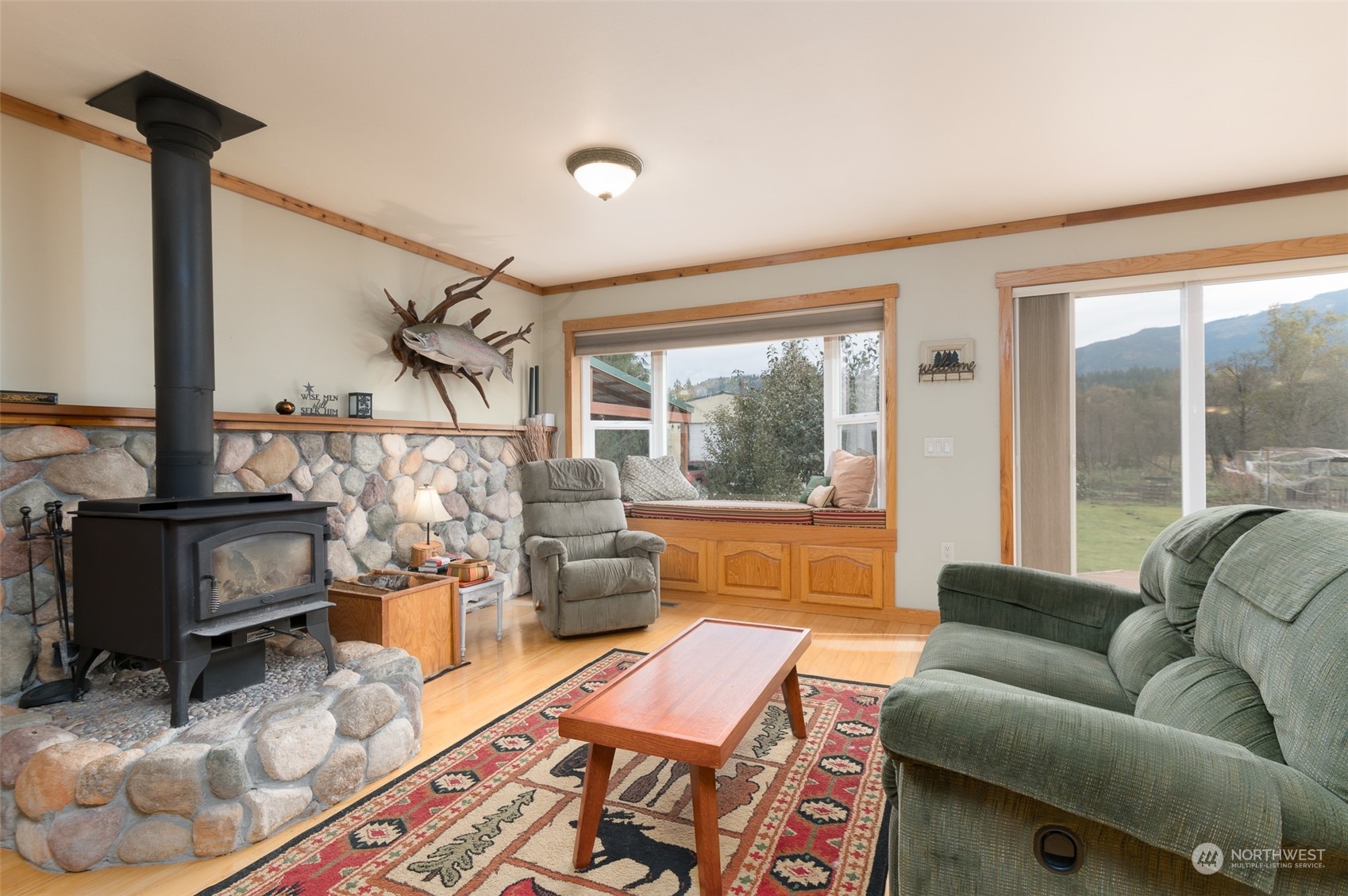 8170 North Telegraph Road Everson, WA 98247 - Photo 12 of 40 a living room with furniture and a floor to ceiling window