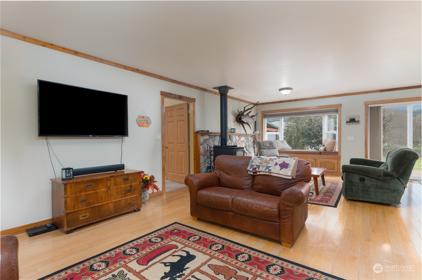8170 North Telegraph Road Everson, WA 98247 - Photo 13 of 40 a living room with furniture and a flat screen tv
