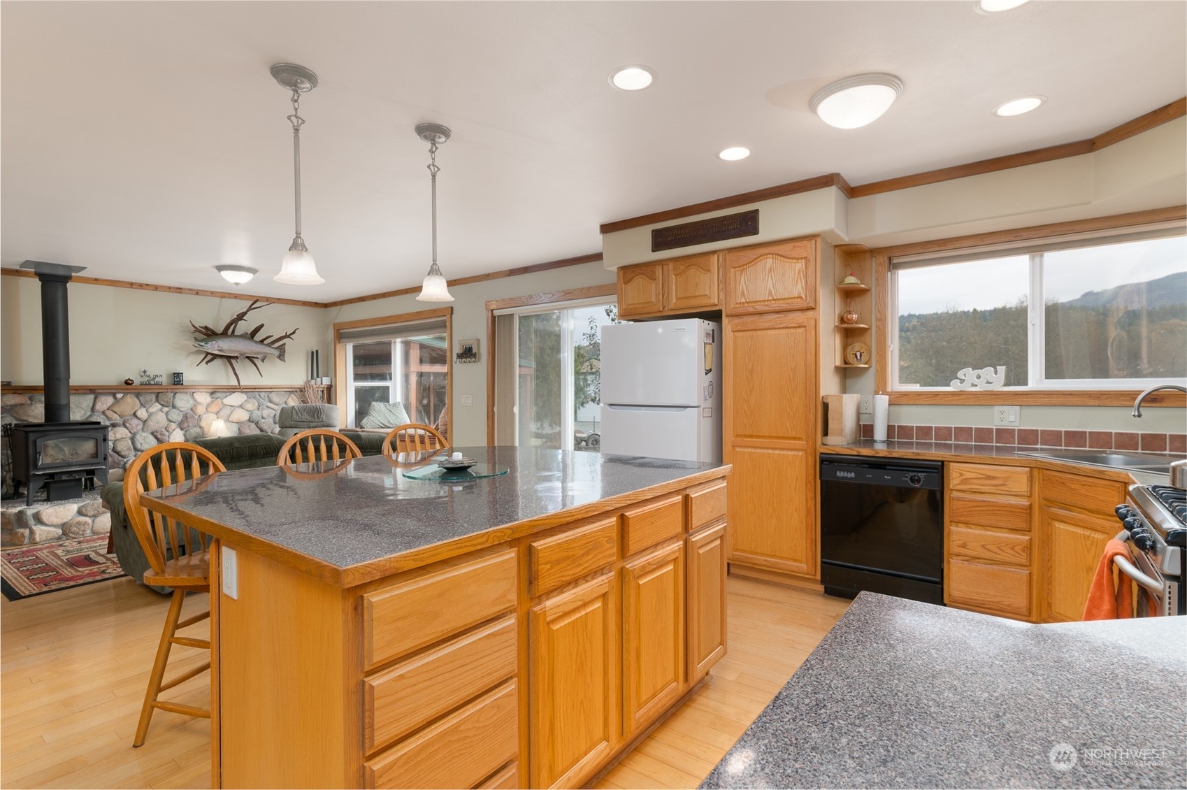 8170 North Telegraph Road Everson, WA 98247 - Photo 17 of 40 a kitchen with stainless steel appliances granite countertop a sink a stove and a refrigerator