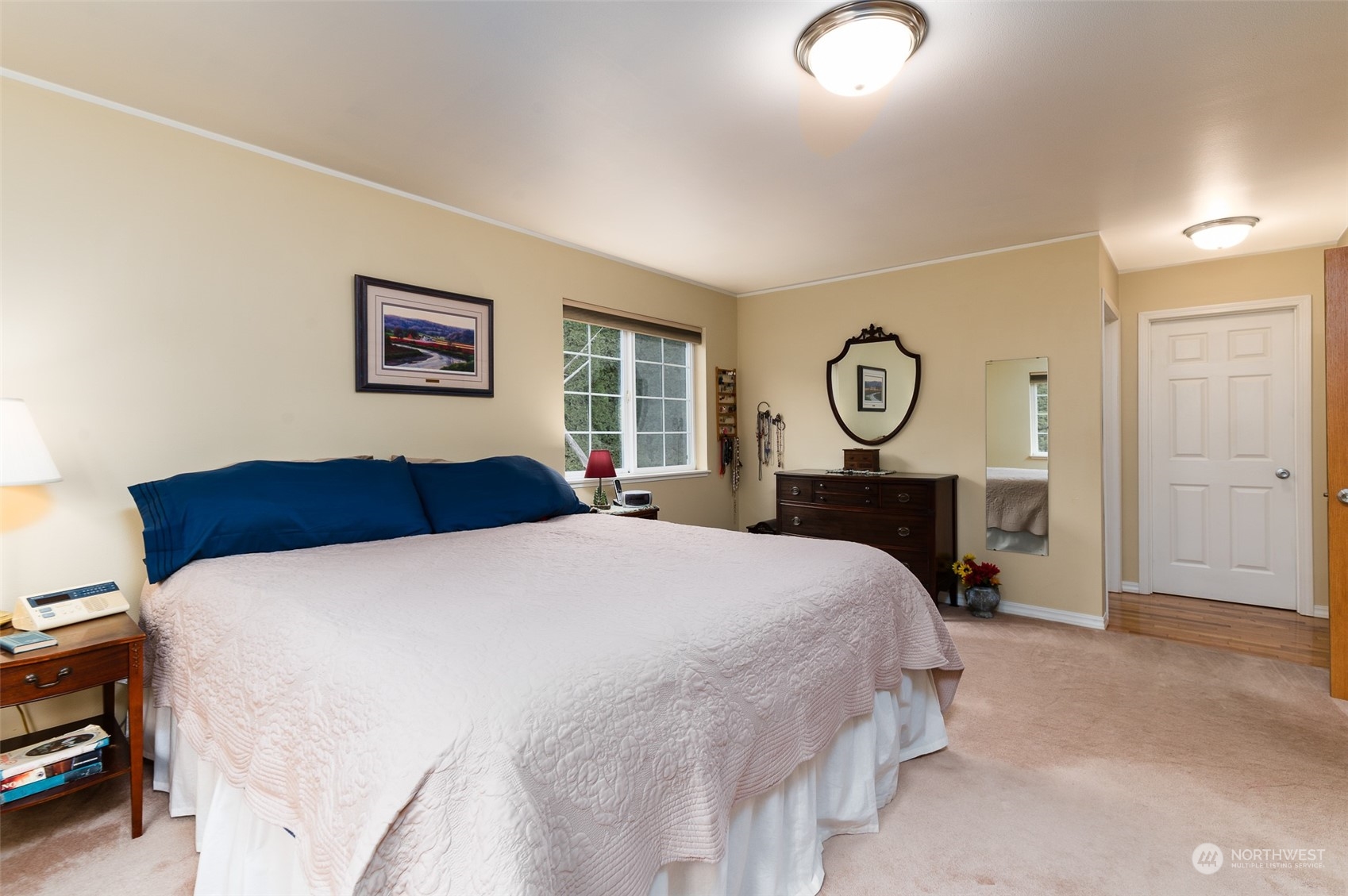 8170 North Telegraph Road Everson, WA 98247 - Photo 20 of 40 a bedroom with a large bed and a chandelier