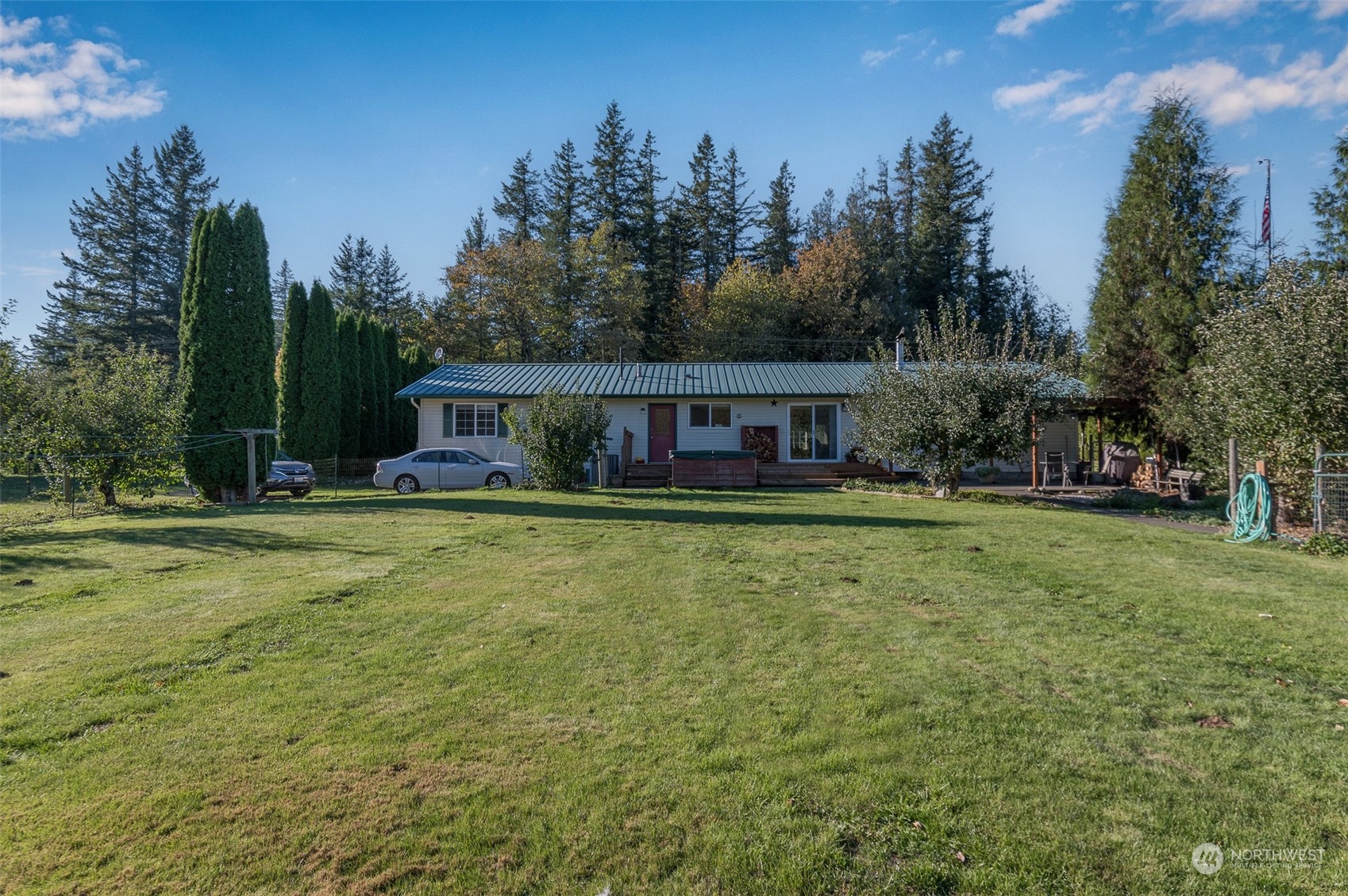 8170 North Telegraph Road Everson, WA 98247 - Photo 34 of 40 a front view of a house with swimming pool having outdoor seating