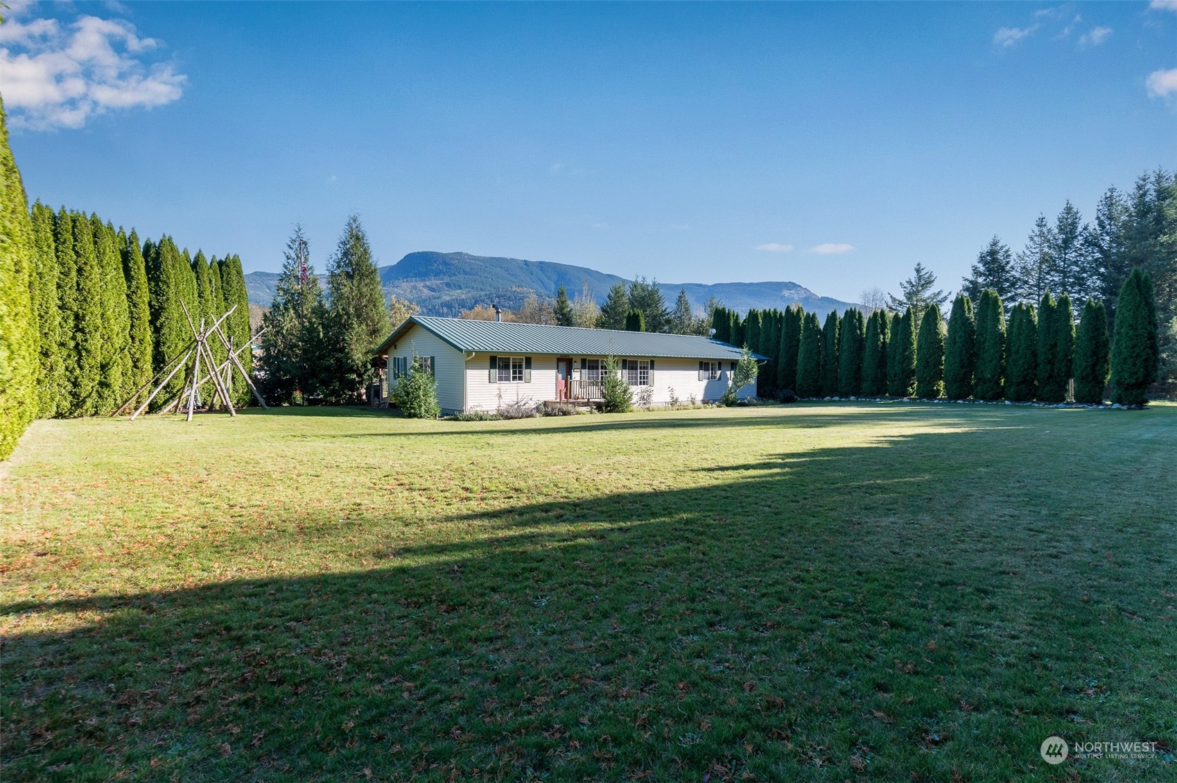 8170 North Telegraph Road Everson, WA 98247 - Photo 4 of 40 a view of house with garden space and trees in the background