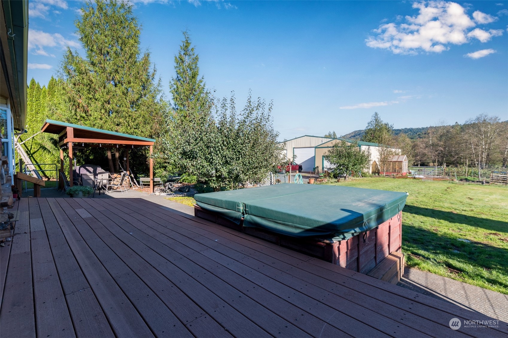8170 North Telegraph Road Everson, WA 98247 - Photo 9 of 40 a view of a deck with wooden floor and outdoor seating
