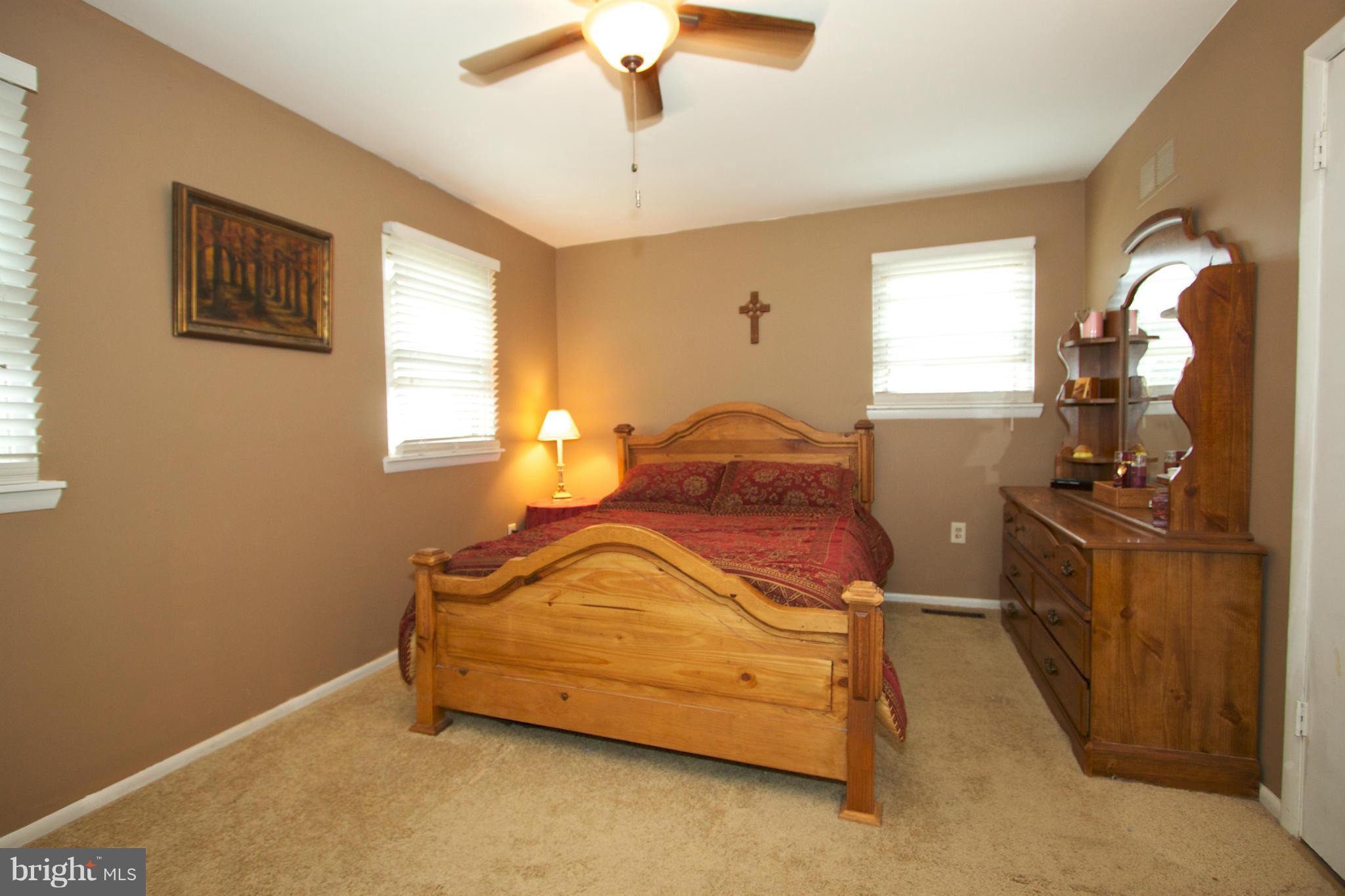 332 Laburnum Road Edgewood, MD 21040 - Photo 14 of 22 a bedroom with a bed and wooden floor