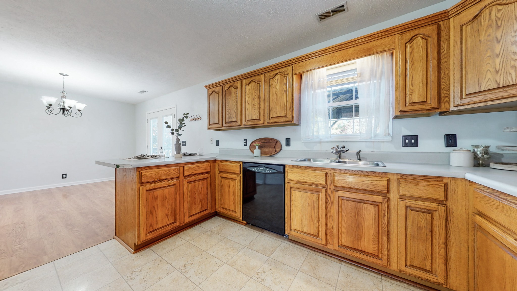 2114 Clara Mathis Road Spring Hill, TN 37174 - Photo 12 of 62 a kitchen with stainless steel appliances granite countertop a sink stove and cabinets