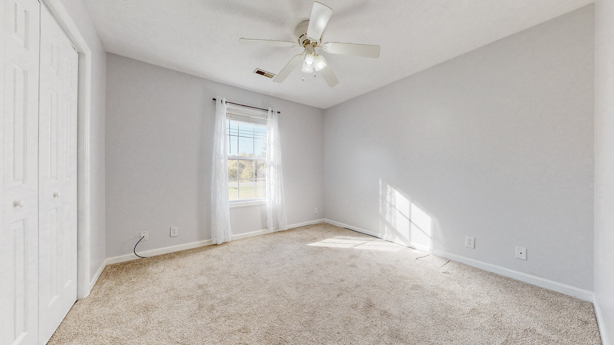 2114 Clara Mathis Road Spring Hill, TN 37174 - Photo 16 of 62 an empty room with windows and ceiling fan