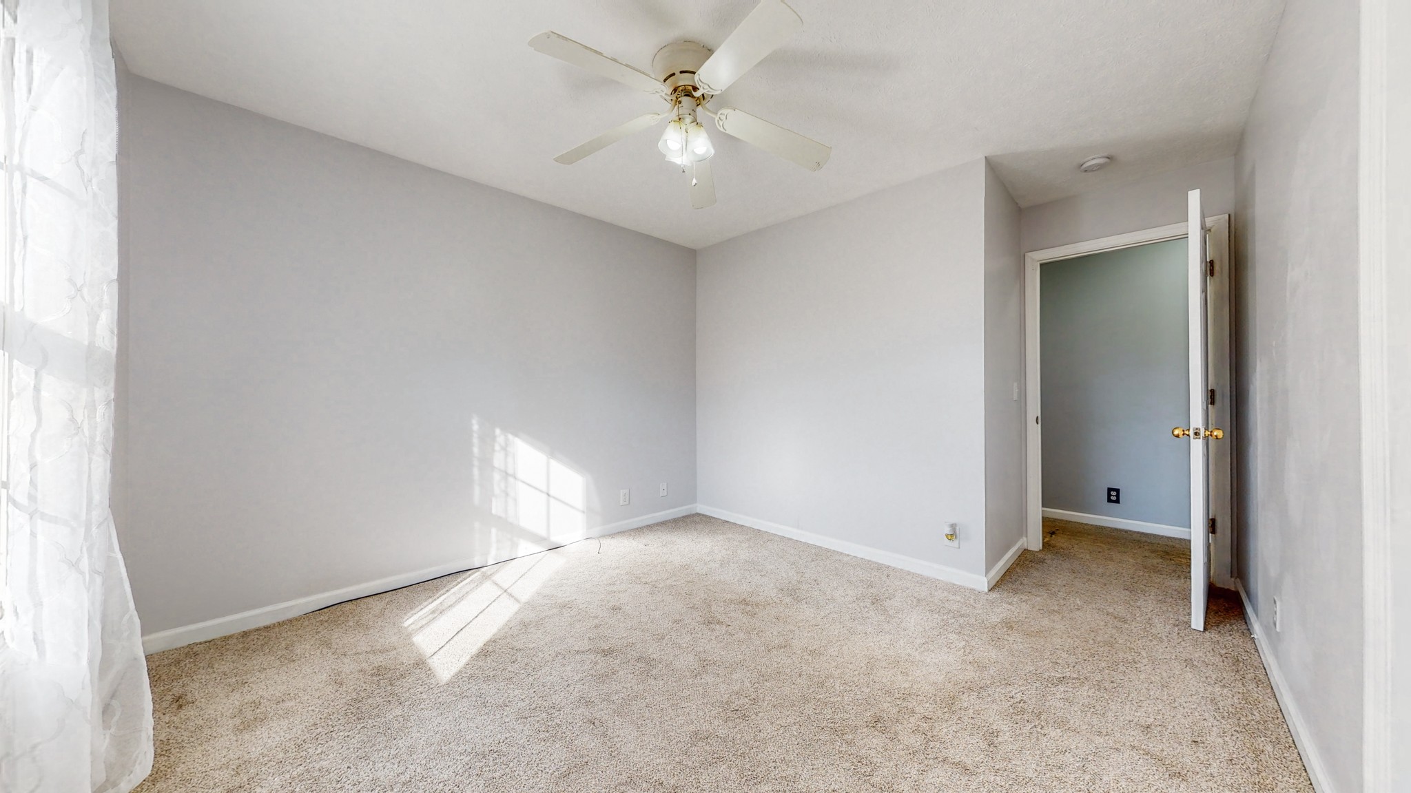 2114 Clara Mathis Road Spring Hill, TN 37174 - Photo 18 of 62 an empty room with closet and a ceiling fan