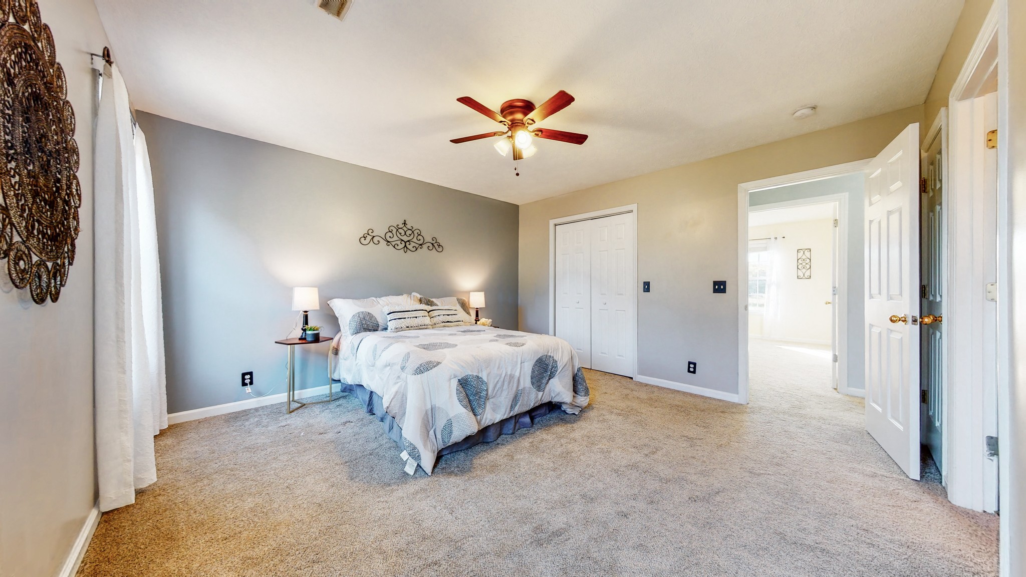 2114 Clara Mathis Road Spring Hill, TN 37174 - Photo 22 of 62 a spacious bedroom with a bed and a chandelier
