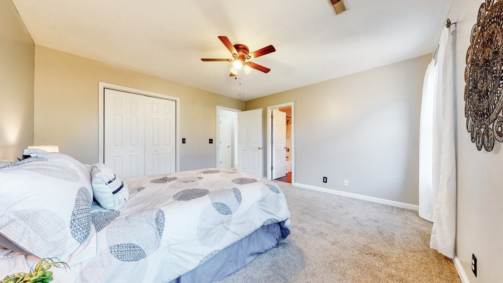 2114 Clara Mathis Road Spring Hill, TN 37174 - Photo 23 of 62 a spacious bedroom with a bed and a chandelier