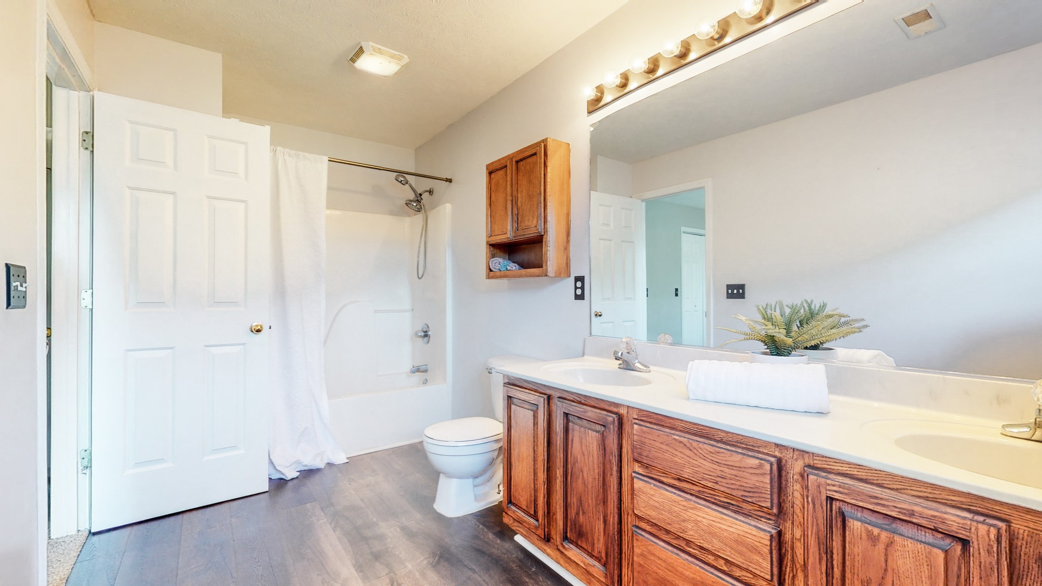 2114 Clara Mathis Road Spring Hill, TN 37174 - Photo 25 of 62 a spacious bathroom with a double vanity sink a large mirror and a shower