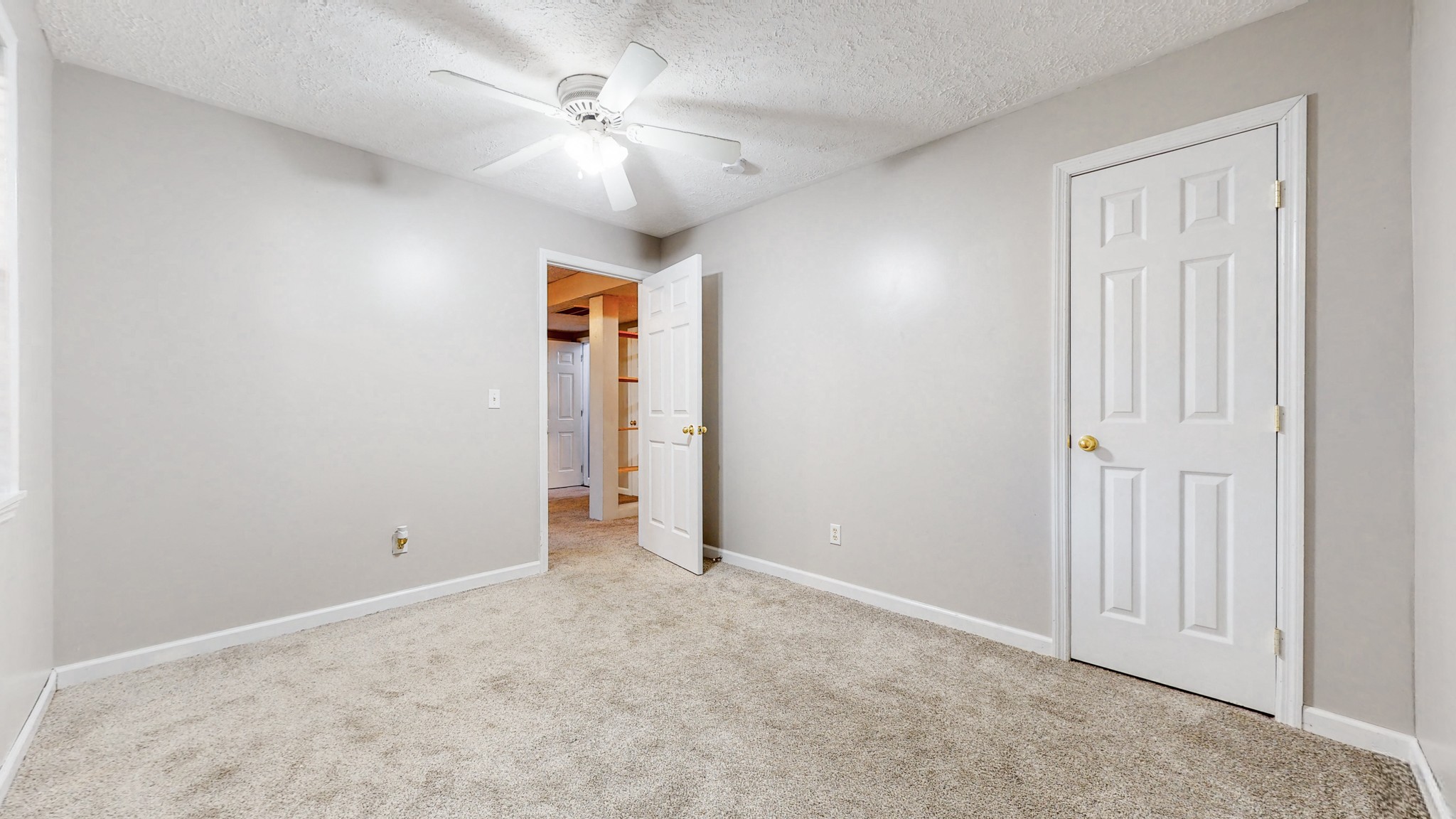 2114 Clara Mathis Road Spring Hill, TN 37174 - Photo 33 of 62 an empty room with a ceiling fan and a window