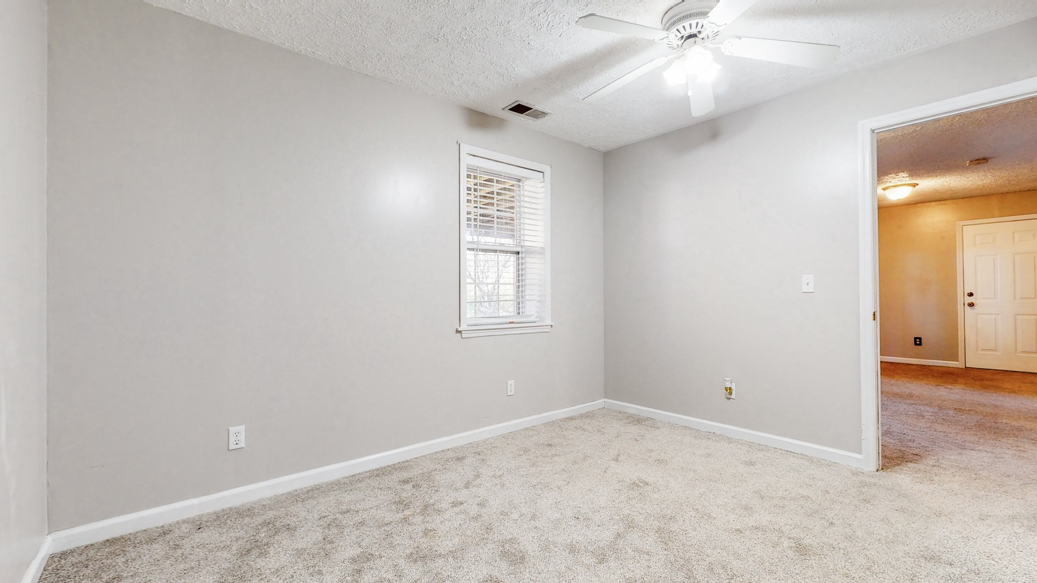2114 Clara Mathis Road Spring Hill, TN 37174 - Photo 34 of 62 an empty room with a ceiling fan and a window