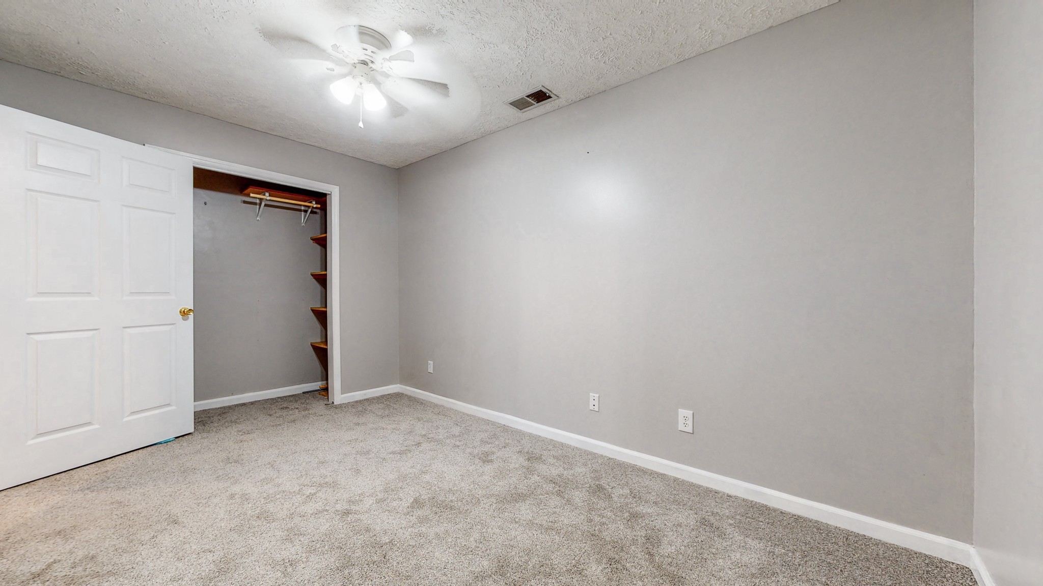 2114 Clara Mathis Road Spring Hill, TN 37174 - Photo 36 of 62 an empty room with closet and a chandelier fan