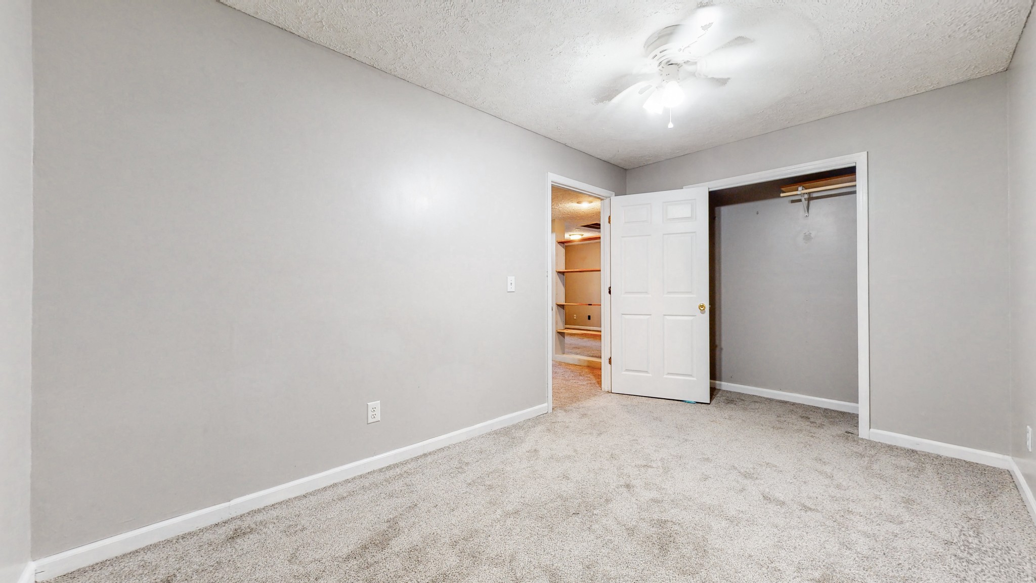 2114 Clara Mathis Road Spring Hill, TN 37174 - Photo 37 of 62 an empty room with a ceiling fan and closet