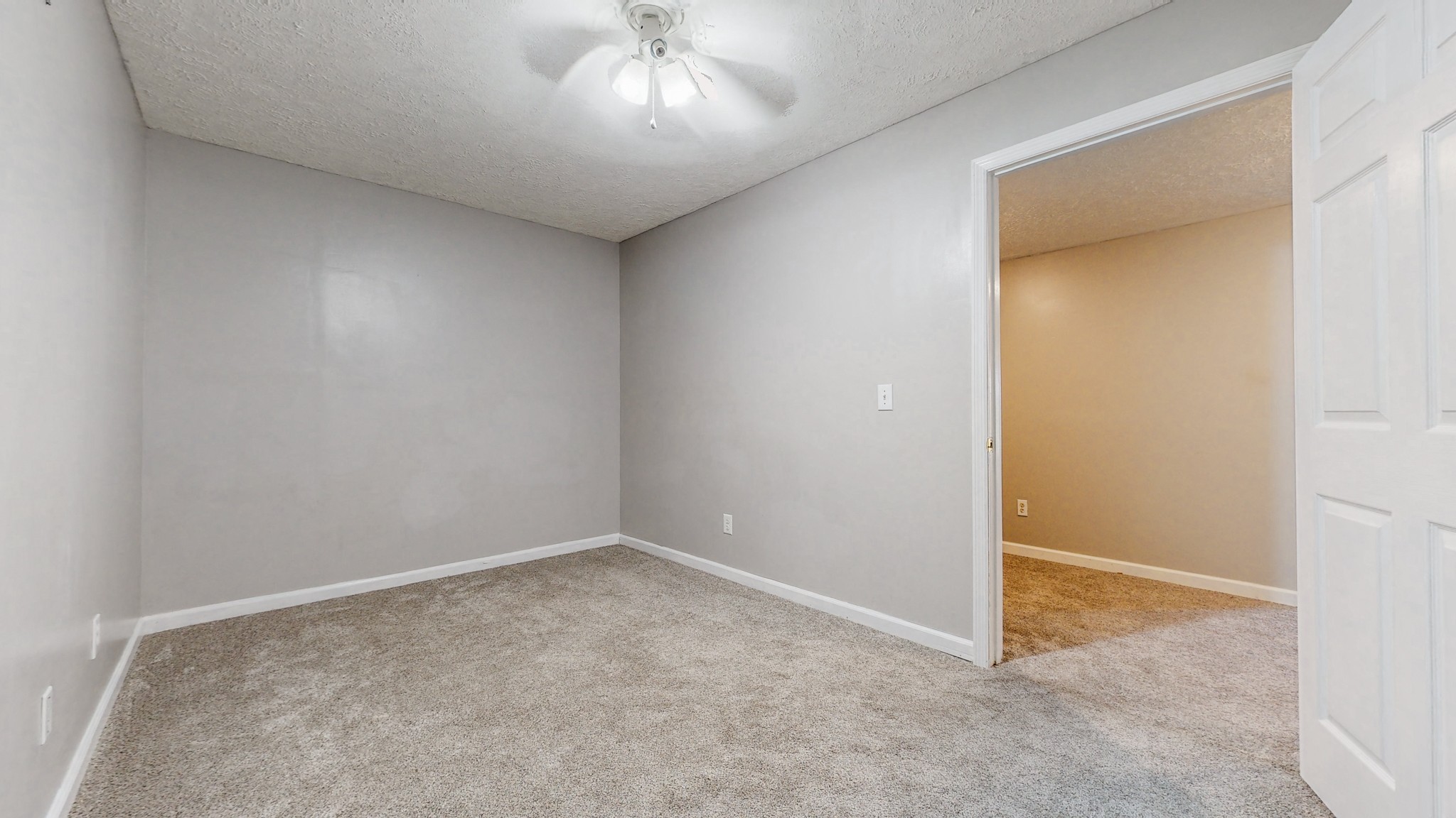 2114 Clara Mathis Road Spring Hill, TN 37174 - Photo 38 of 62 an empty room with a chandelier fan