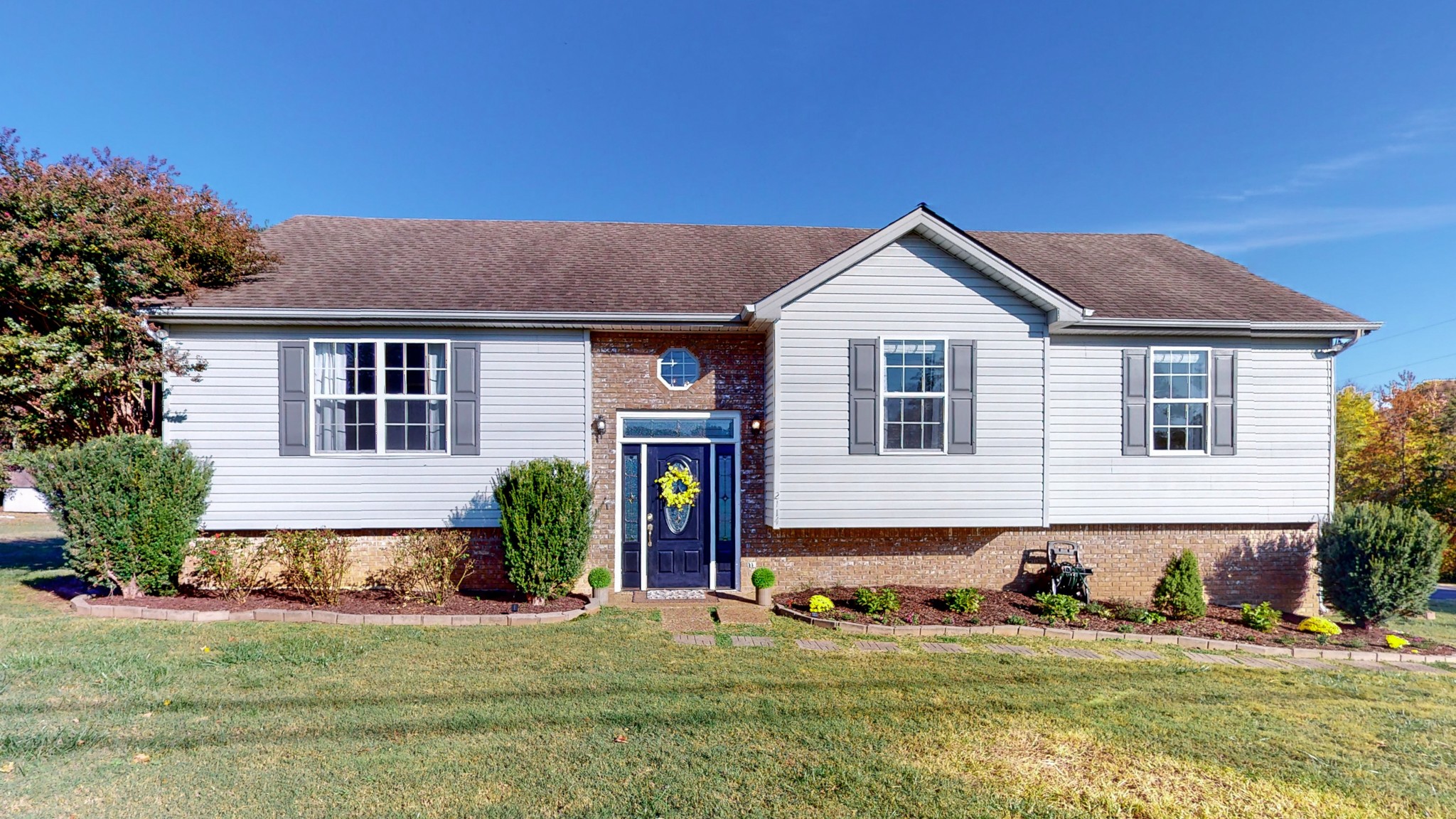 2114 Clara Mathis Road Spring Hill, TN 37174 - Photo 39 of 62 a front view of a house with a yard and garage