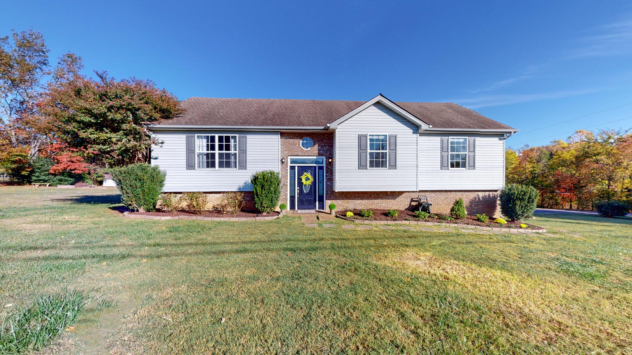 2114 Clara Mathis Road Spring Hill, TN 37174 - Photo 42 of 62 a front view of a house with a yard and trees