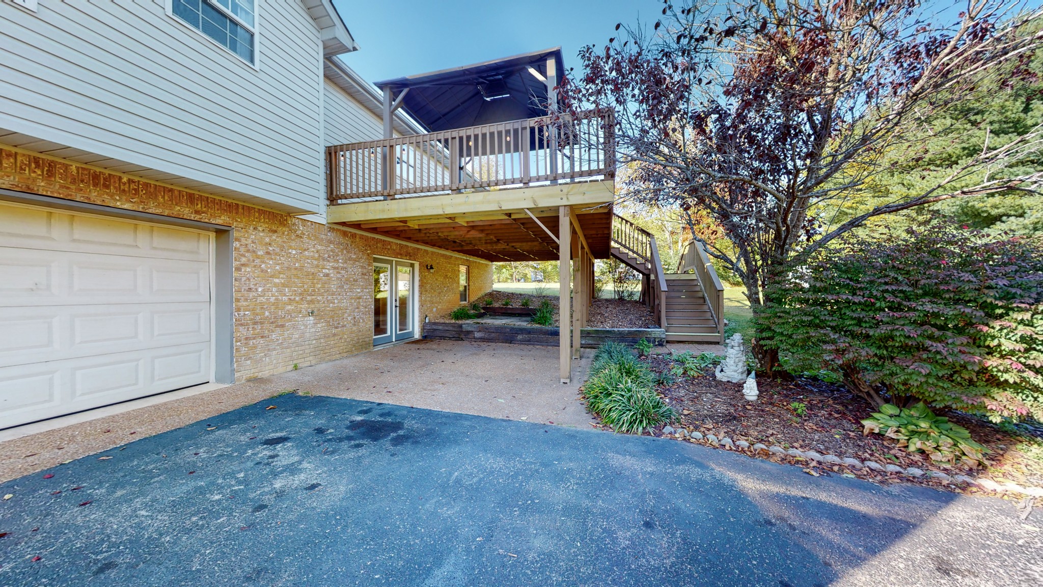 2114 Clara Mathis Road Spring Hill, TN 37174 - Photo 49 of 62 a view of a patio with table and chairs under an umbrella