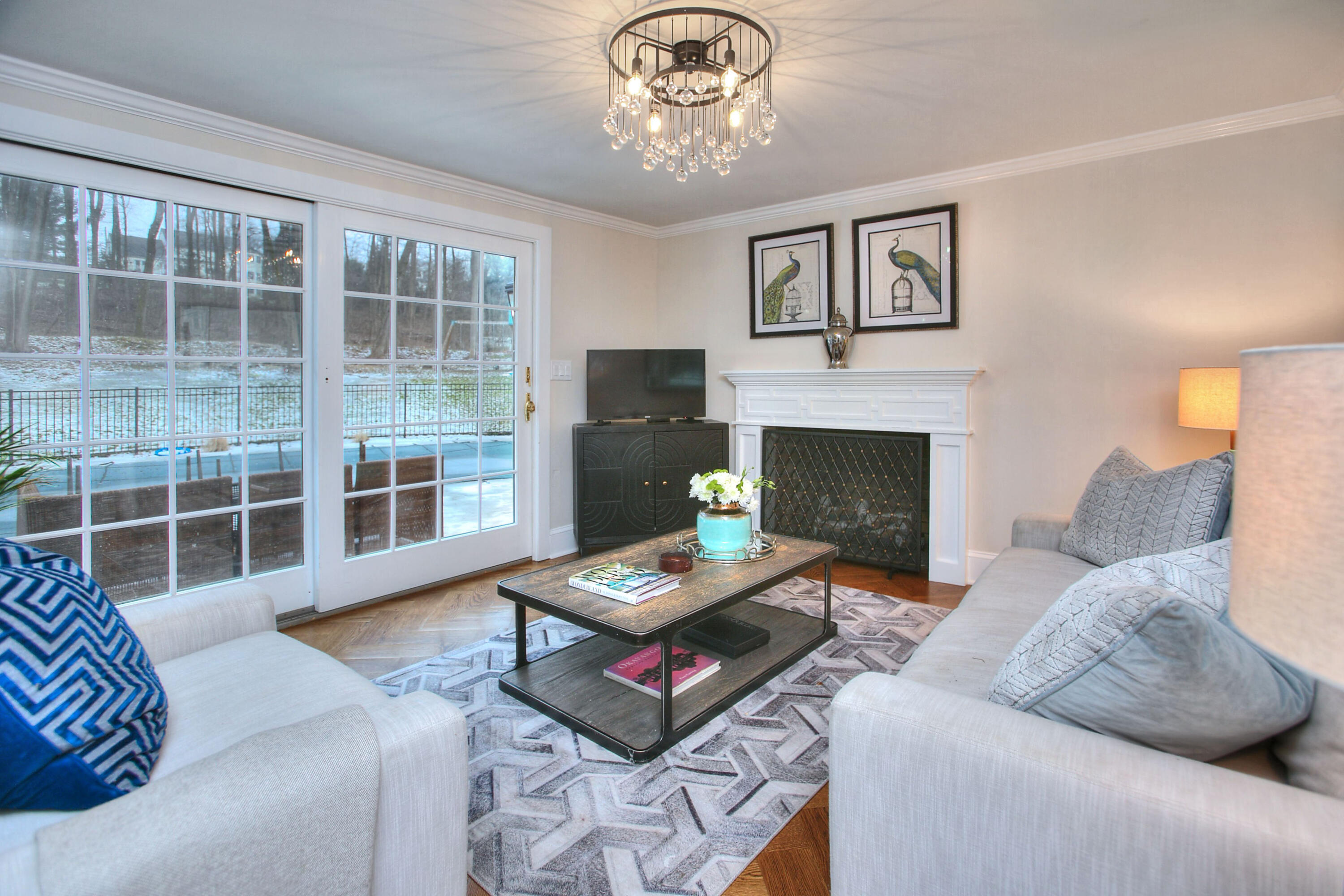 45 Beech Road New Canaan, CT 06840 - Photo 15 of 37 a living room with furniture and a fireplace