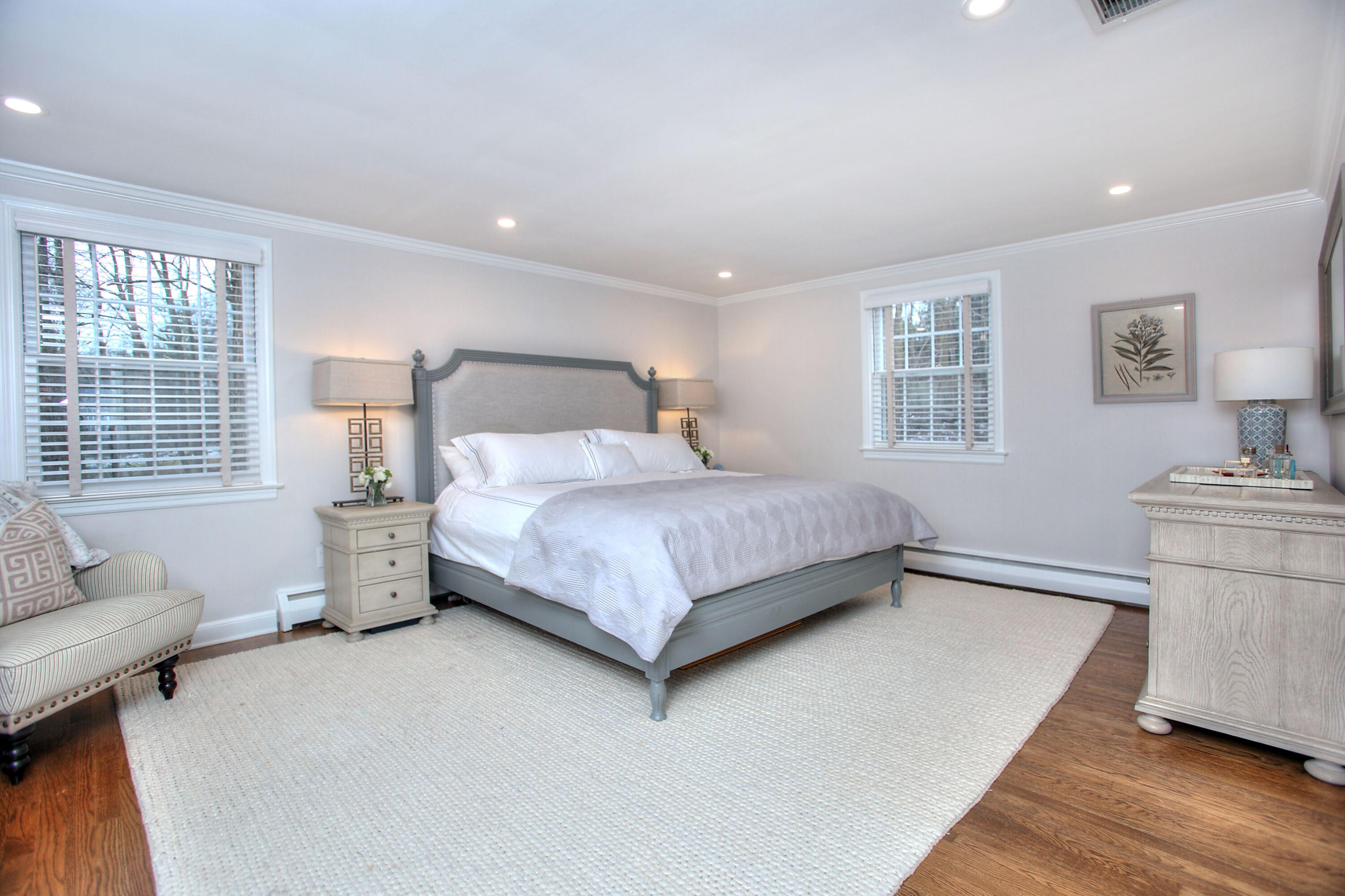 45 Beech Road New Canaan, CT 06840 - Photo 24 of 37 a bedroom with a bed and wooden floor