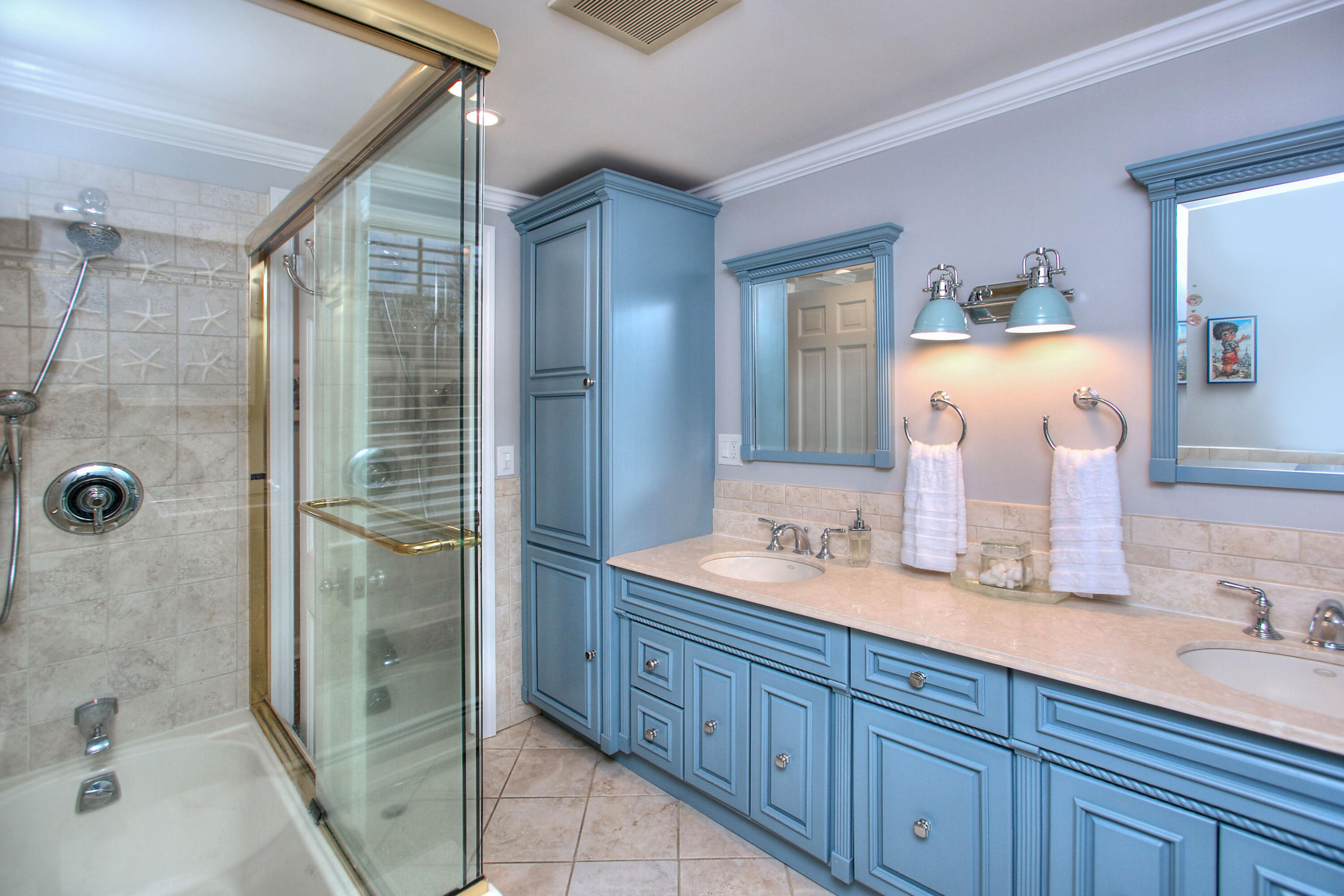 45 Beech Road New Canaan, CT 06840 - Photo 30 of 37 a bathroom with a double vanity sink mirror and shower